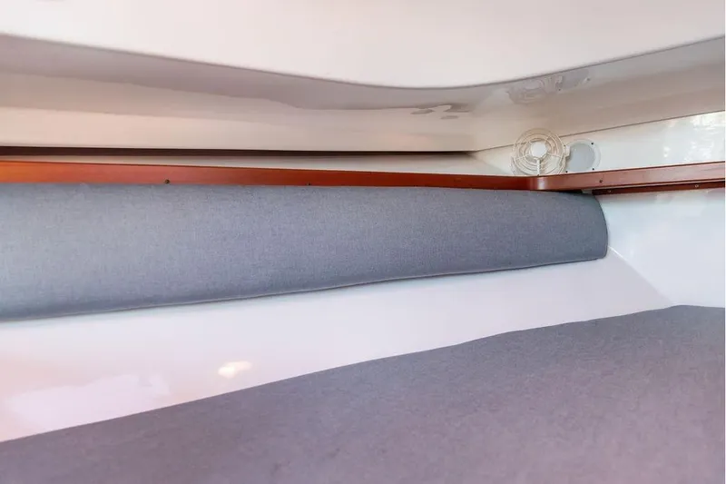 Slide: The Image of Interior cabin view of 2007 Hunt Surfhunter 29 boat with gray upholstery. - 42