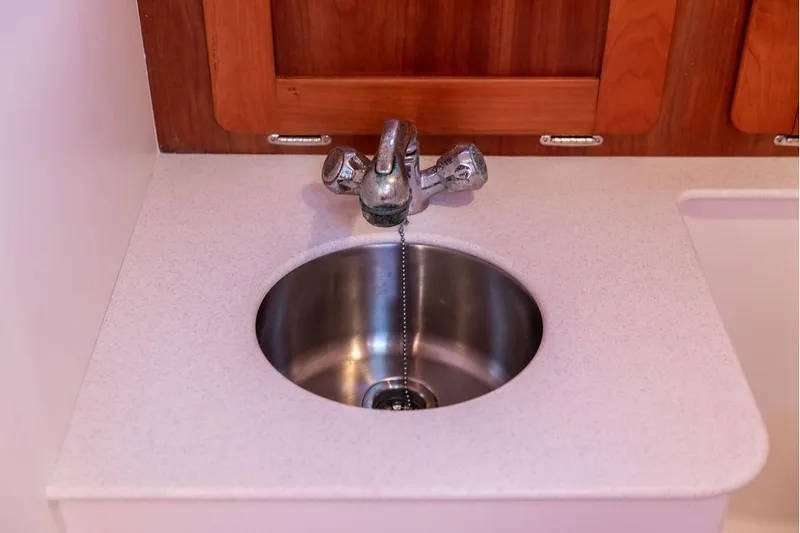 Slide: The Image of Stainless steel sink with faucet in 2007 Hunt Surfhunter 29 boat interior. - 47