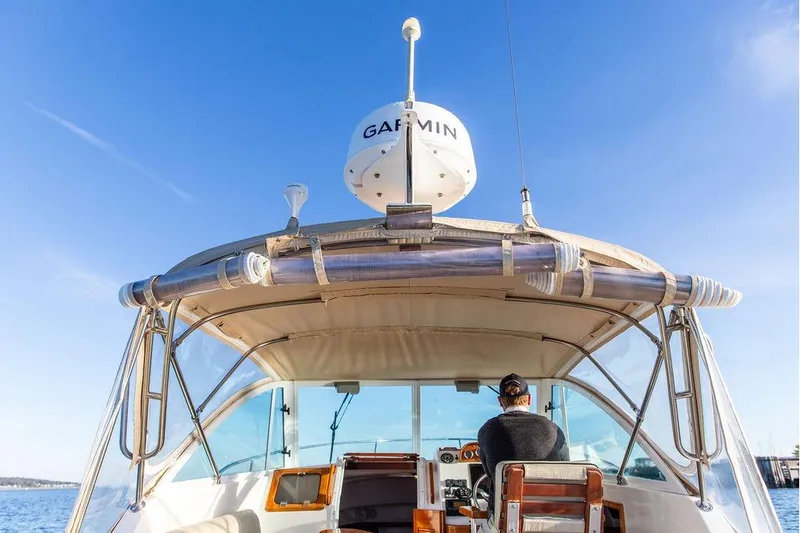 Slide: The Image of 2007 Hunt Surfhunter 29 boat with Garmin equipment, cruising under clear blue skies. - 18