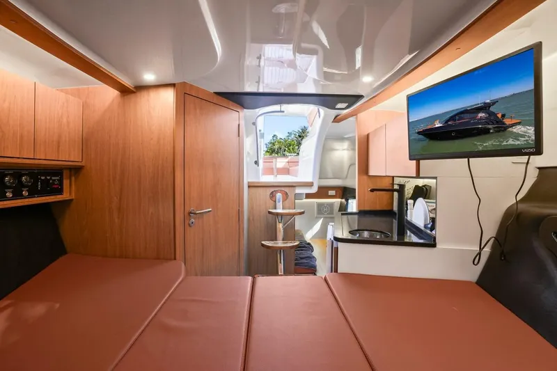 Slide: The Image of Interior of 2025 Hanover 355 Outboard boat with modern amenities and sleek design. - 16