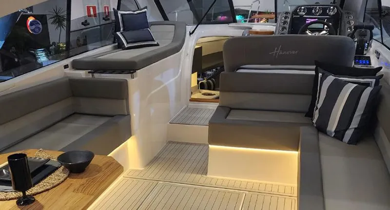 Slide: The Image of Luxurious interior of 2025 Hanover 355 Outboard boat with elegant seating and ambient lighting. - 20