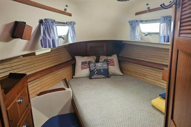 Slide: The Image of Cozy cabin interior of 1999 Island Packet 350 sailboat with nautical decor. - 27