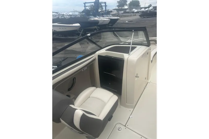 Slide: The Image of 2015 Yamaha Boats 242 Limited interior with seating and dashboard view. - 14