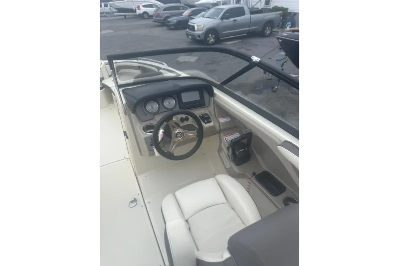 Slide: The Image of 2015 Yamaha Boats 242 Limited cockpit with steering wheel and dashboard controls. - 16