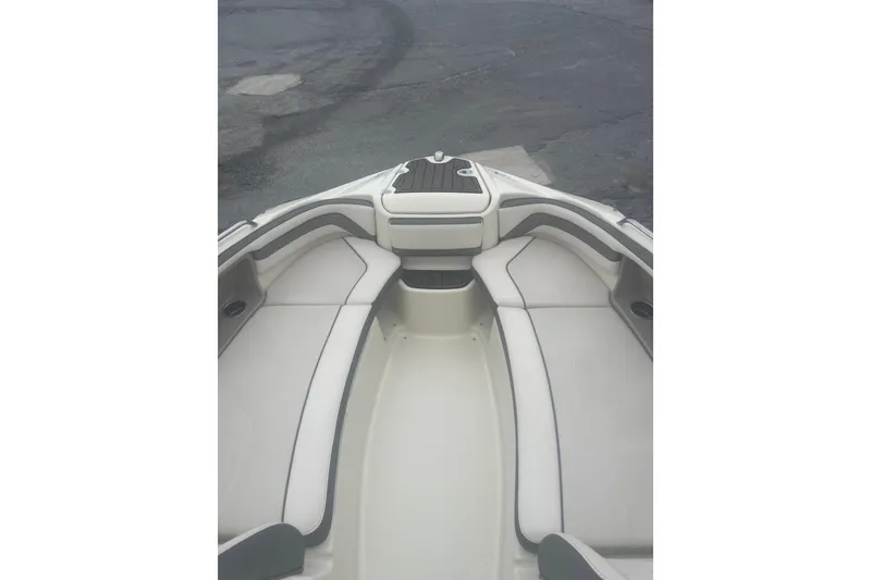 Slide: The Image of 2015 Yamaha Boats 242 Limited interior with cushioned seating and sleek design. - 19