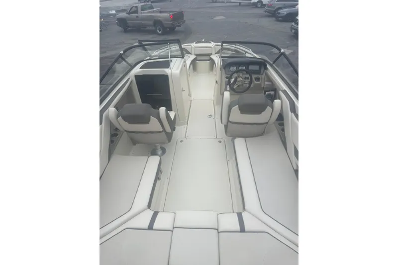 Slide: The Image of 2015 Yamaha Boats 242 Limited interior with seating and dashboard view. - 8