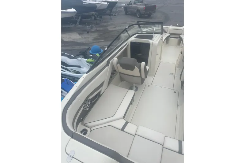 Slide: The Image of 2015 Yamaha Boats 242 Limited interior with beige seating and sleek design. - 9