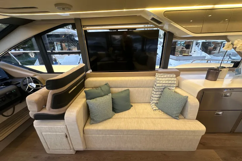 Slide: The Image of Luxurious interior of 2026 Cruisers Yachts 57 Fly with plush seating and modern design. - 17