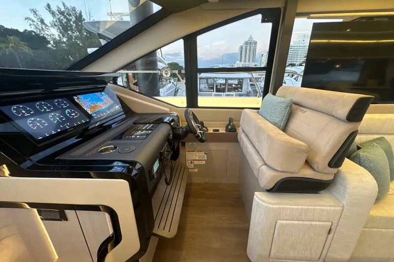 Slide: The Image of Luxurious helm of 2026 Cruisers Yachts 57 Fly with advanced navigation displays. - 19