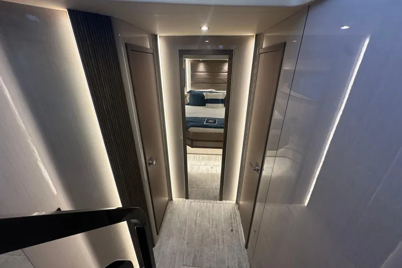 Slide: The Image of Luxurious interior hallway of 2026 Cruisers Yachts 57 Fly, featuring modern design and ambient lighting. - 22