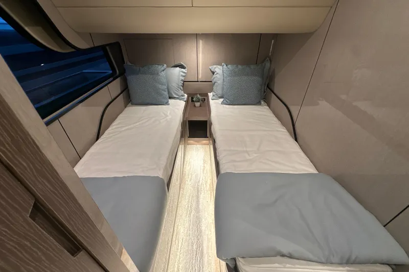 Slide: The Image of Luxurious twin cabin interior of 2026 Cruisers Yachts 57 Fly, featuring modern design and comfort. - 24