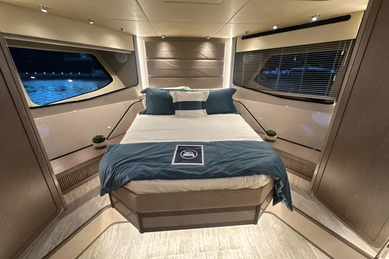 Slide: The Image of Luxurious bedroom interior of 2026 Cruisers Yachts 57 Fly, featuring elegant design and ambient lighting. - 26