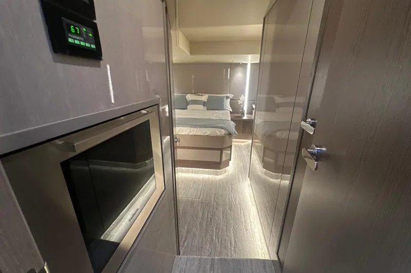 Slide: The Image of Luxurious interior of 2026 Cruisers Yachts 57 Fly, featuring modern bedroom and sleek design. - 31