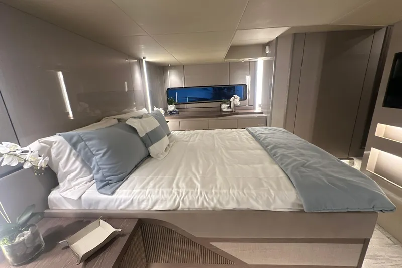Slide: The Image of Luxurious bedroom interior of 2026 Cruisers Yachts 57 Fly, featuring elegant bedding and modern design. - 38