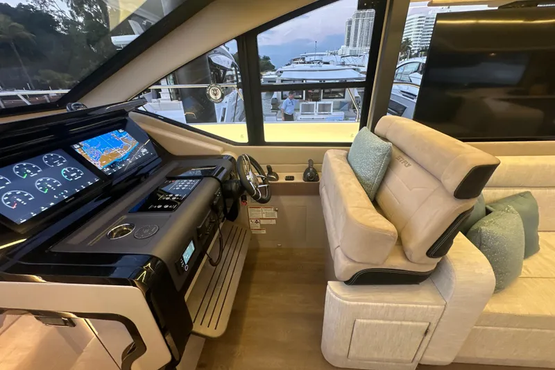 Slide: The Image of Luxurious 2026 Cruisers Yachts 57 Fly helm with modern navigation displays and plush seating. - 45