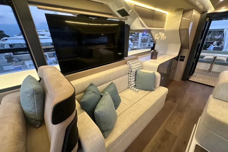 Slide: The Image of Luxurious interior of 2026 Cruisers Yachts 57 Fly with modern decor and large TV. - 46