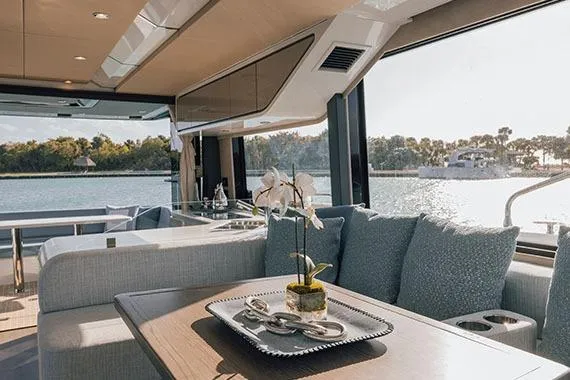 Slide: The Image of Luxurious 2026 Cruisers Yachts 57 Fly interior with elegant seating and modern lighting. - 5