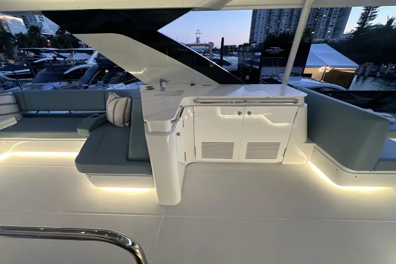 Slide: The Image of Luxurious 2026 Cruisers Yachts 57 Fly interior with elegant seating and ambient lighting. - 51