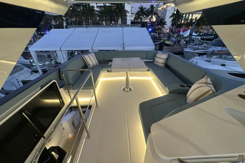 Slide: The Image of Luxurious 2026 Cruisers Yachts 57 Fly with elegant seating and ambient lighting. - 52