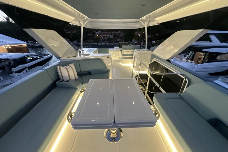 Slide: The Image of Luxurious 2026 Cruisers Yachts 57 Fly interior with elegant seating and ambient lighting. - 54