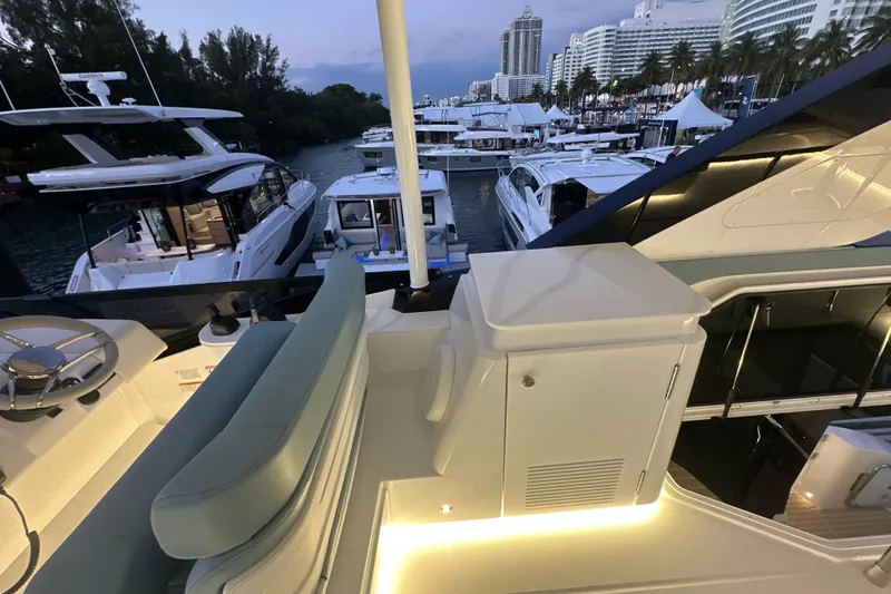 Slide: The Image of Luxurious 2026 Cruisers Yachts 57 Fly at marina, showcasing elegant design and modern amenities. - 59