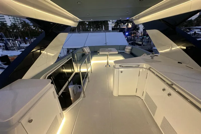 Slide: The Image of Luxurious 2026 Cruisers Yachts 57 Fly deck with modern lighting and sleek design. - 60