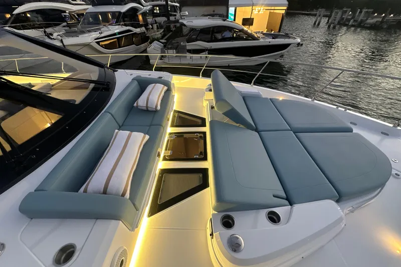 Slide: The Image of Luxurious 2026 Cruisers Yachts 57 Fly with elegant deck seating and ambient lighting. - 62