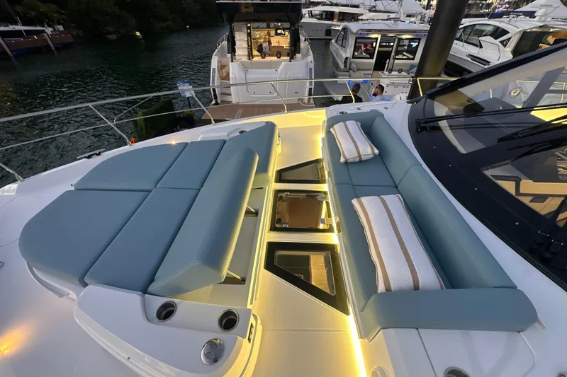 Slide: The Image of Luxurious 2026 Cruisers Yachts 57 Fly with elegant seating and ambient lighting. - 64