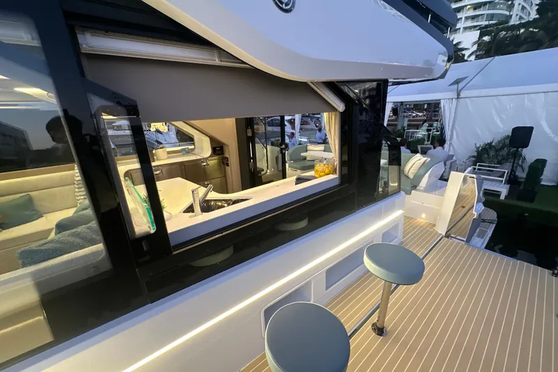 Slide: The Image of Luxurious 2026 Cruisers Yachts 57 Fly with modern interior and outdoor seating. - 66