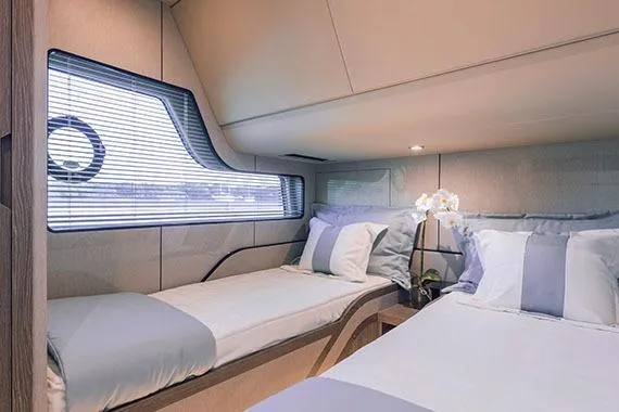 Slide: The Image of 2026 Cruisers Yachts 57 Fly docked, showcasing sleek deck design and modern features. - 8