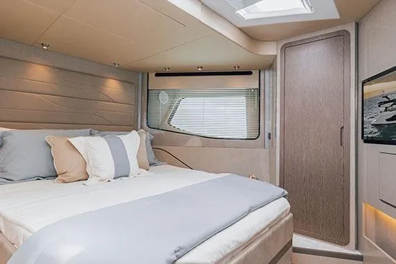 Slide: The Image of Manufacturer Provided Image: Luxurious bedroom interior of 2026 Cruisers Yachts 57 Fly with modern design and cozy bedding. - 10