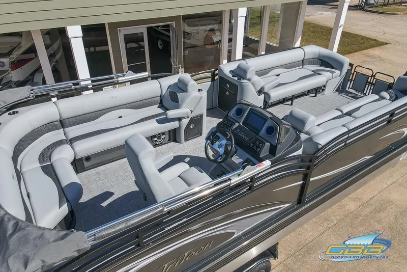 Slide: The Image of 2026 JC 25 Neptoon LG pontoon boat with spacious seating and modern dashboard. - 13