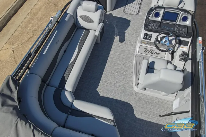 Slide: The Image of 2026 JC 25 Neptoon LG boat interior with gray seating and modern dashboard. - 19