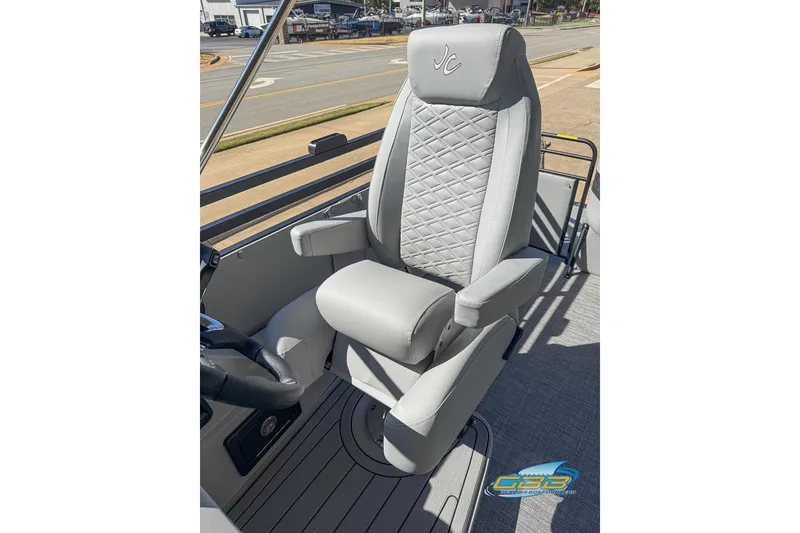 Slide: The Image of Captain's chair on 2026 JC 25 Neptoon LG pontoon boat, featuring quilted upholstery. - 25