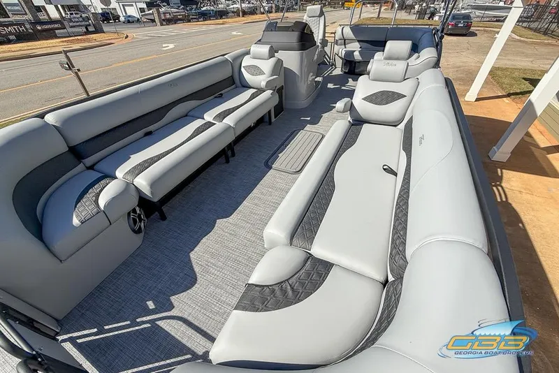 Slide: The Image of Luxurious interior of 2026 JC 25 Neptoon LG pontoon boat with plush seating. - 26