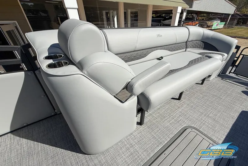 Slide: The Image of Luxurious seating on 2026 JC 25 Neptoon LG pontoon boat with cup holders. - 28