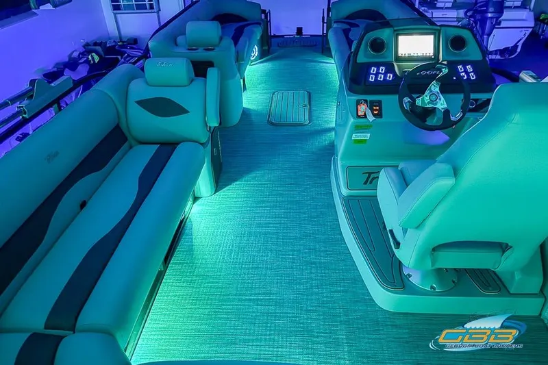 Slide: The Image of Luxurious 2026 JC 25 Neptoon LG boat interior with ambient lighting and modern dashboard. - 5