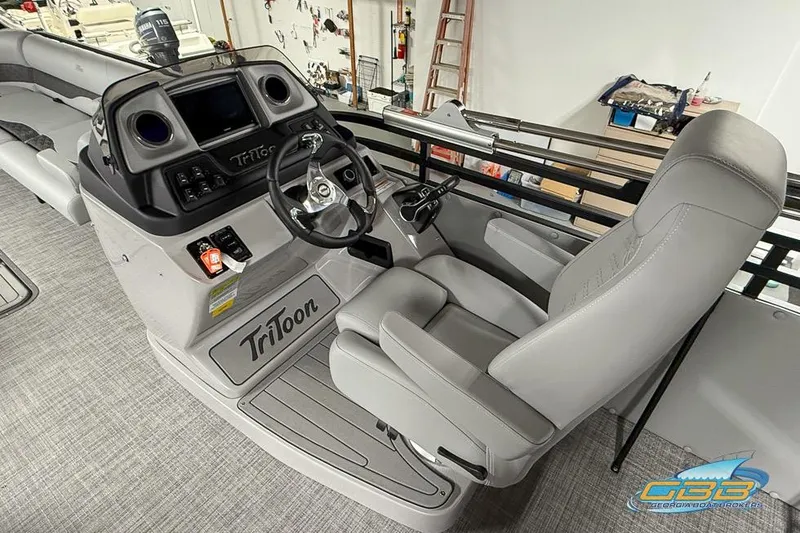 Slide: The Image of 2026 JC 25 Neptoon LG boat interior with steering console and captain's chair. - 57