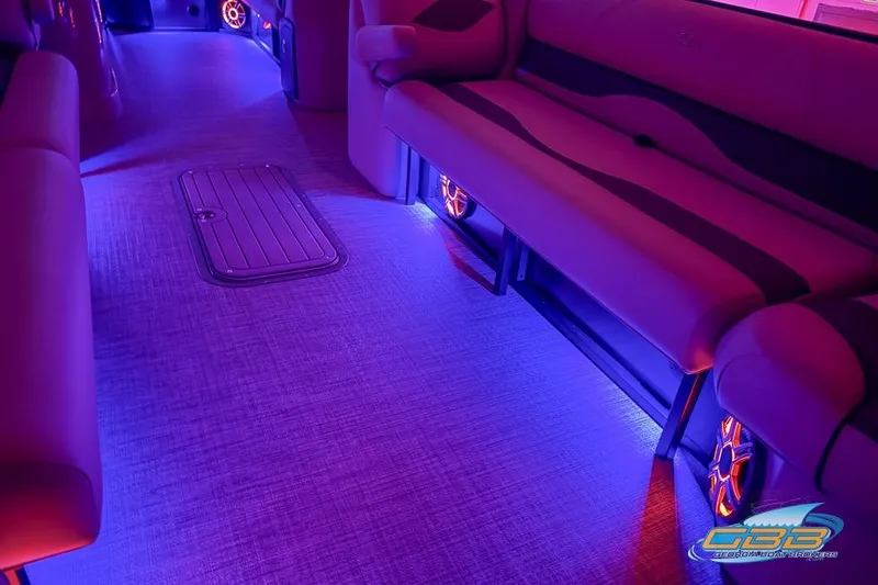 Slide: The Image of Interior of 2026 JC 25 Neptoon LG boat with vibrant purple LED lighting. - 60