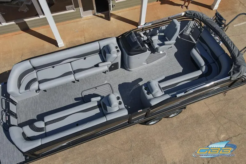 Slide: The Image of 2026 JC 25 Neptoon LG boat interior with steering console and seating. - 18