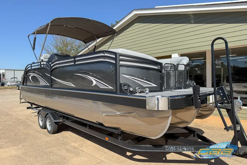 Slide: The Image of 2026 JC 25 Neptoon LG pontoon boat interior with gray seating and open gate. - 39