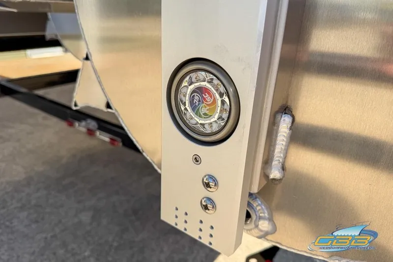 Slide: The Image of 2026 JC 25 Neptoon LG pontoon boat on trailer, parked outdoors. - 43