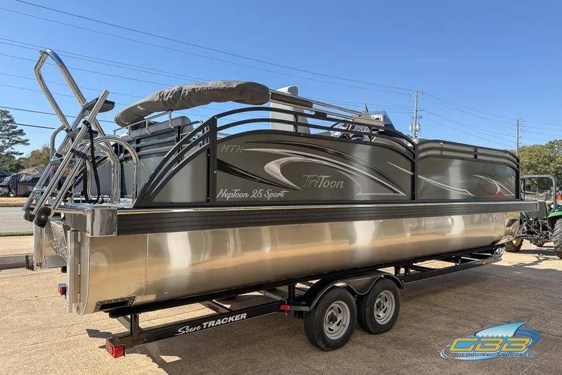 Slide: The Image of 2026 JC 25 Neptoon LG pontoon boat with sleek design and Tritoon branding. - 48