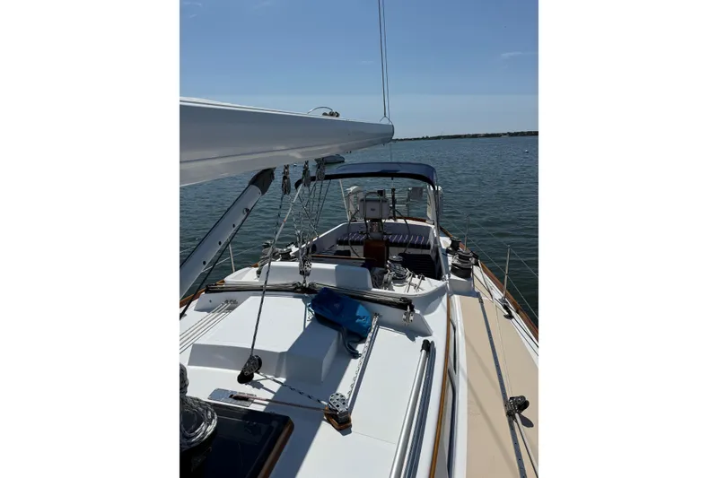 Slide: The Image of Hinckley Sou'wester 42 Sloop, 1994, sailing on calm waters under clear skies. - 2