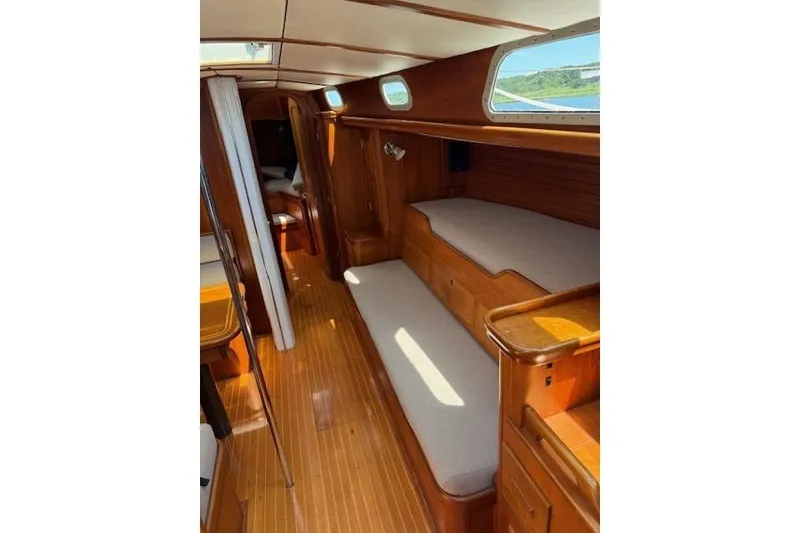 Slide: The Image of Interior of 1994 Hinckley Sou'wester 42 Sloop with wooden finish and cozy seating. - 4