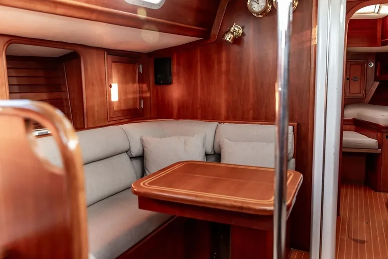 Slide: The Image of Luxurious 1994 Hinckley Sou'wester 42 yacht interior with elegant wood finish and cozy seating. - 15