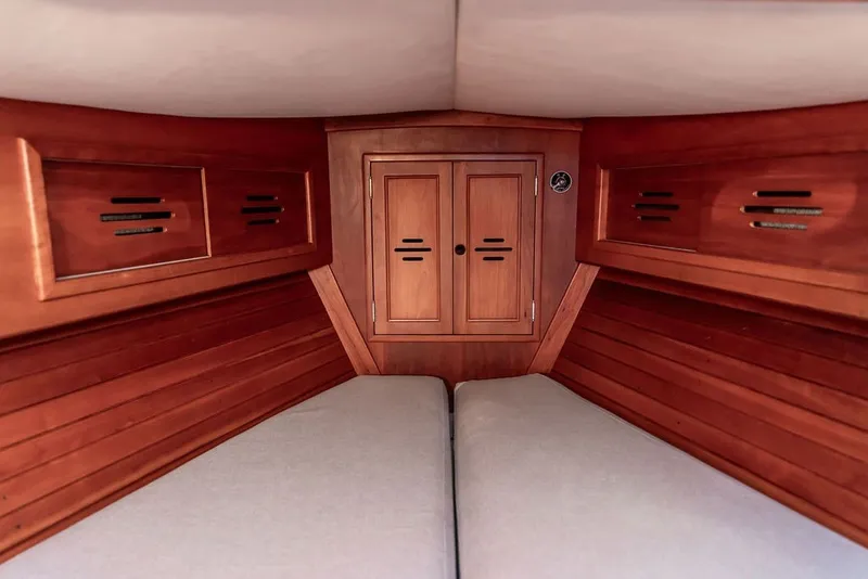 Slide: The Image of Interior cabin of 1994 Hinckley Sou'wester 42 sailboat with wooden finish and storage compartments. - 21