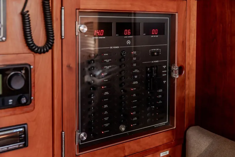 Slide: The Image of Control panel on a 1994 Hinckley Sou'wester 42 yacht, featuring digital displays and switches. - 26