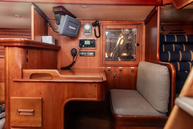 Slide: The Image of Interior of 1994 Hinckley Sou'wester 42 yacht with navigation equipment and wooden furnishings. - 20
