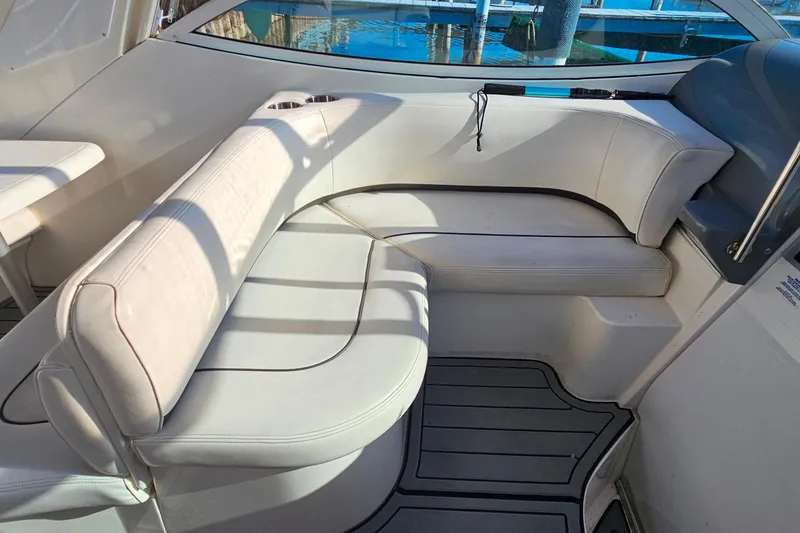Slide: The Image of 2006 Cruisers Yachts 300 Express interior with control panel and seating area. - 12
